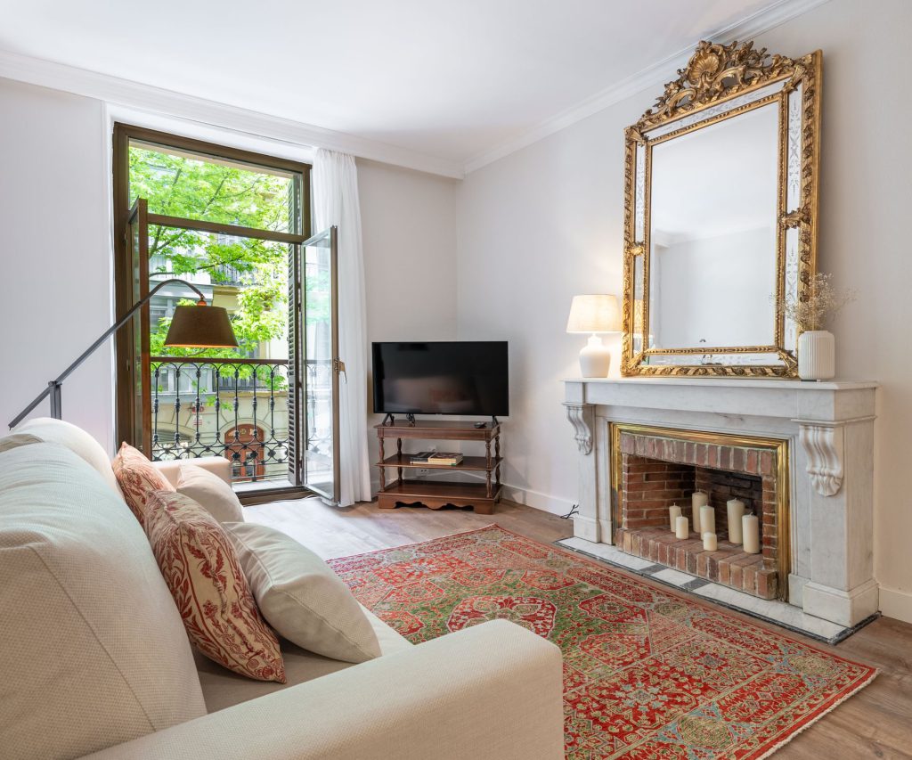 Living room with marble fireplace at Garibai Heritage Residence