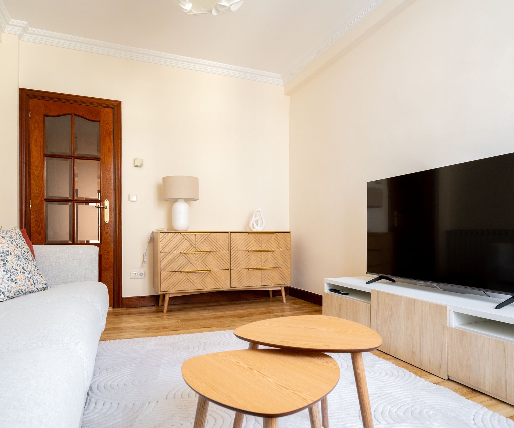 Bright living room at Gros Urban Glow Apartment